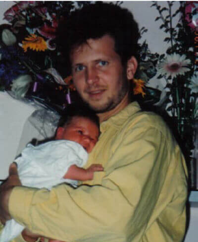 Michael holding baby Alina